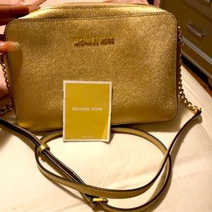 Gold Michael Kora Jet set purse